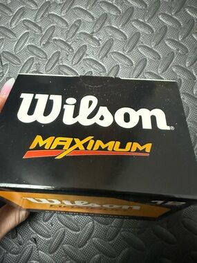 Wilson Golf Ball Box in Black with Orange and Red Accents